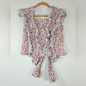 ANTHROPOLOGIE BLUE TASSEL TRINA BACK BOW FLORAL BLOUSE.